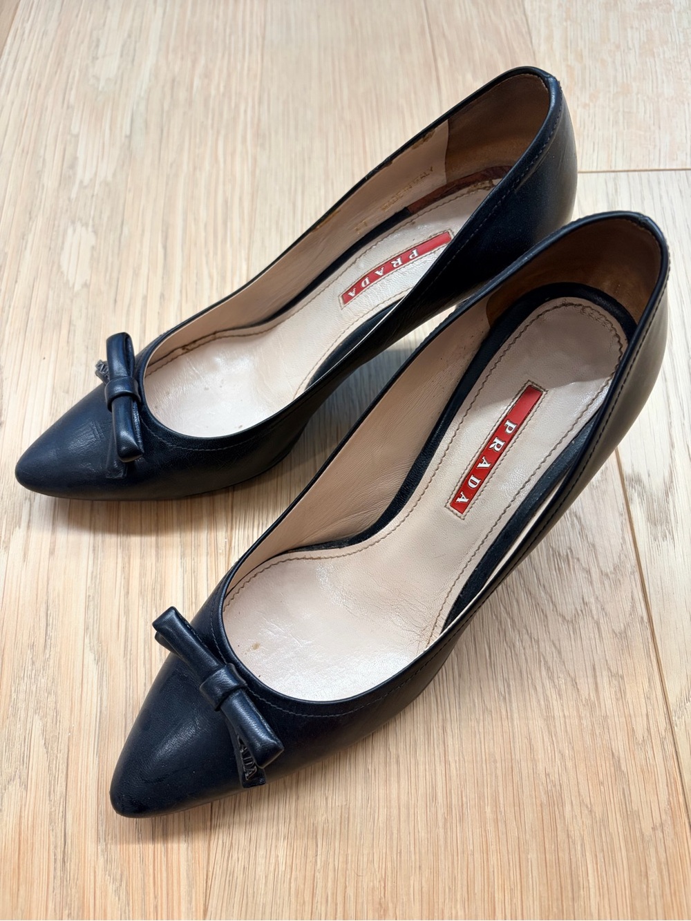 Prada Black Pointed-Toe Leather Pumps with Bow Accent